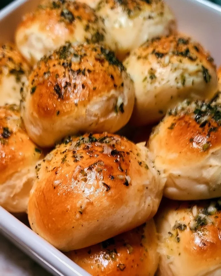 Freshly baked garlic bread rolls served warm and golden brown